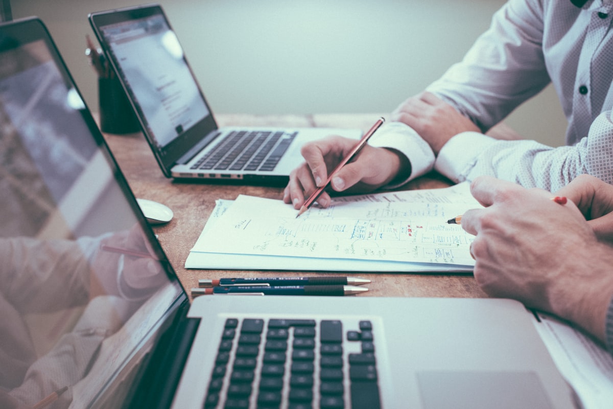 ERP implementation planning with business documents and laptop